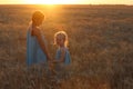 Girls on a wheat field Royalty Free Stock Photo