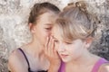 Girls whispering secrets Royalty Free Stock Photo