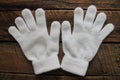 Girls White Winter Gloves Isolated on Wooden Background