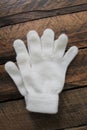 Girls White Winter Gloves Isolated on Wooden Background