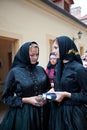 Girls in widow's weeds folk costume of Vracov