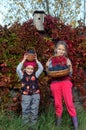 Girls with wild grapes in the autumn colors.
