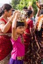 Girls among women at wedding procession in Mysore, India.