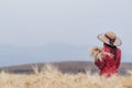 The girls wore red vintage dresses that were blessed above the golden barley fields in the morning alone