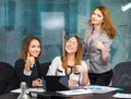 Business girls in office show a gesture of good Royalty Free Stock Photo