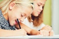 Girls writing homework Royalty Free Stock Photo