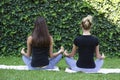 Girls yoga outside park