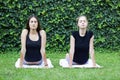 Girls yoga outside park