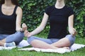 Girls yoga outside park