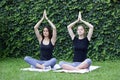 Girls yoga outside park