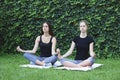 Girls yoga outside park