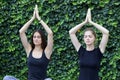 Girls yoga outside park