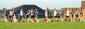 High-fives for all at the end of a girls soccer game.