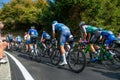 Giro di lombardia group cyclists engaged in the ascent of dossena