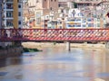 Girona City view on red the Eiffel bridge over Onyar river