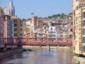 Girona City Spain view on red the Eiffel bridge over Onyar river. Royalty Free Stock Photo