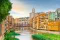 Girona colorful houses district, bridge, and Saint Mary Cathedral, buildings reflected in water in river Onyar. Catalonia Spain Royalty Free Stock Photo