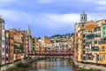 Girona cityscape with Eiffel bridge over Onyar river, Spain