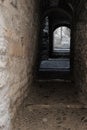 Girona`s landmark narrow streets with cobble stone and stairs on a long outdoor corridor and nobody on it