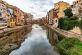 Girona, Spain, August 2018. Beautiful reflection of colorful houses in the dark water of a canal. Royalty Free Stock Photo