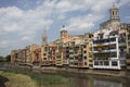 Girona, Spain, May 1, 2020 - LGBT flag over residential houses along Onyar river Royalty Free Stock Photo