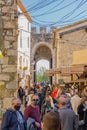 GIRONA, SPAIN - 11 OCTOBER 2020: People with protective masks walking down a street in the town of BesalÃÂº Royalty Free Stock Photo