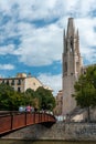 Collegiate Church of Sant Felix and bridge across the Onyar River, as seen from the street, Girona, Spain Royalty Free Stock Photo