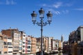 Girona, Spain - September 15, 2016: view on Girona riverside. Antique lantern on the bridge