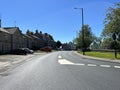 Gisburn high street, set against a vivid blue sky in, Gisburn, Lancashire, UK