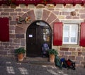 Gite du chemin and Hiker`s backpacks in St Jean Pied de Port, France, key destination along the Camino de Santiago Royalty Free Stock Photo