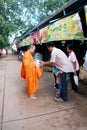 Give alms to a Buddhist monk Royalty Free Stock Photo