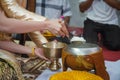 Give alms to a Buddhist monk in wedding day Royalty Free Stock Photo