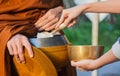 Give alms to a Buddhist monk Royalty Free Stock Photo