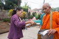 Give food offerings to a Buddhist monk in Morning Royalty Free Stock Photo