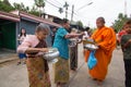 Give food offerings to a Buddhist monk in Morning Royalty Free Stock Photo