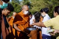 give food offerings to a Buddhist monk On the occasion of Thai Father's Day , 5 December 2023 , Buriram Thailand. Royalty Free Stock Photo