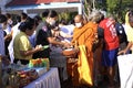 give food offerings to a Buddhist monk On the occasion of Thai Father's Day , 5 December 2023 , Buriram Thailand. Royalty Free Stock Photo