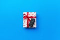 Give gift car key concept top view. Present box with red ribbon bow, heart and car key on blue colored background Royalty Free Stock Photo