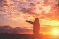 Give the gift on the Day of LoveRomantic girl walking in a field in sunset light. Winter, autumn life Royalty Free Stock Photo