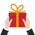 Give a gift. A man holds a red gift box with an orange ribbon in his hands.Giving, receiving surprise. Vector illustration flat