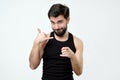 Give me a call concept. Good looking spanish young man gesturing Royalty Free Stock Photo