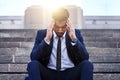 Give me a minute I need to think. a young businessman experiencing a migraine.