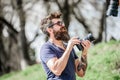 Give me a smile. hipster man in summer sunglasses. photo of nature. reporter or journalist. Mature hipster with beard Royalty Free Stock Photo