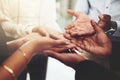 Give me your hand and let me help you. Closeup shot of a group of businesspeople standing with their hands cupped