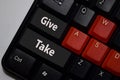 Give or Take isolated on laptop keyboard background. Bargaining or Bartering concept Royalty Free Stock Photo