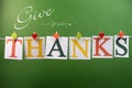 Give Thanks message hanging from pegs on a line for Thanksgiving greeting Royalty Free Stock Photo