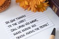 Give thanks to the LORD, handwritten Christian verse with pumpkin, autumn flowers, and holy bible