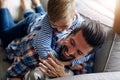 Give them as much of your time as you can. a father and his little son bonding together at home. Royalty Free Stock Photo