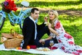 Give uncommon, unique gifts spontaneously. Enjoying their perfect date. Couple in love picnic date. Spring weekend Royalty Free Stock Photo