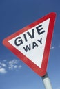 Give Way Sign Against A Blue Sky Royalty Free Stock Photo